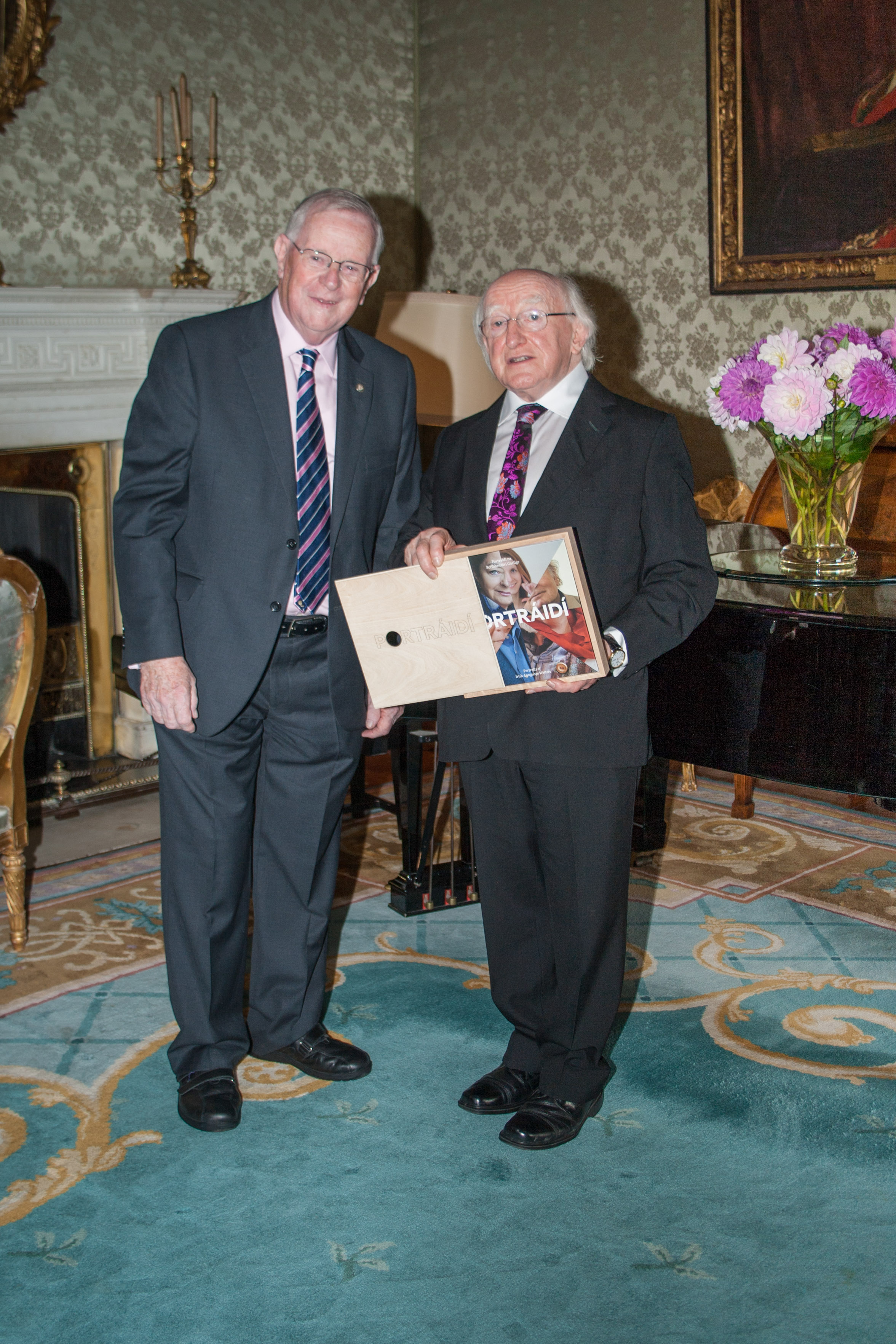 Vivian Ó Mathúna presents Portraits of Irish-Language Writers to the President of Ireland